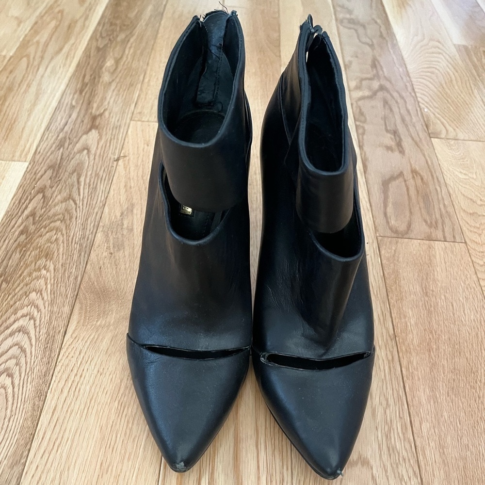 BCBG high heeled leather stiletto booties with gold tone
